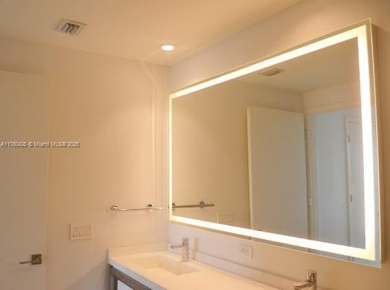 bathroom with visible vents and vanity