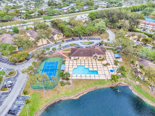 birds eye view of property with a water view