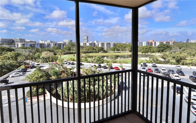 balcony with a view of city and a water view