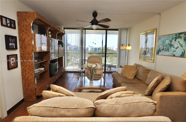 living area with dark wood-style flooring, ceiling fan, and floor to ceiling windows