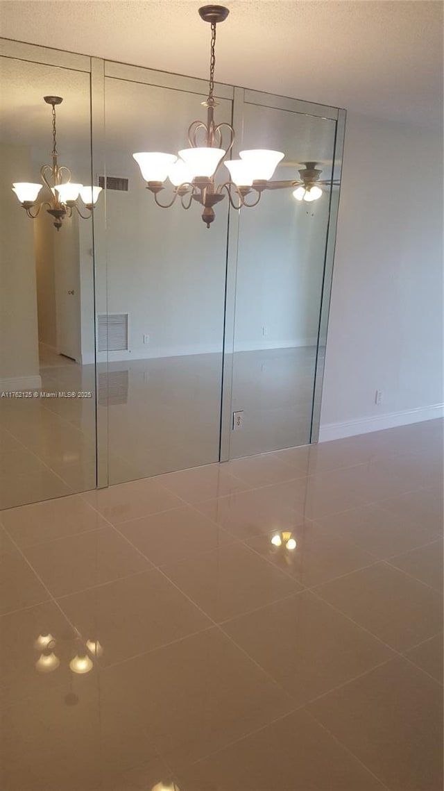 interior space featuring an inviting chandelier and visible vents