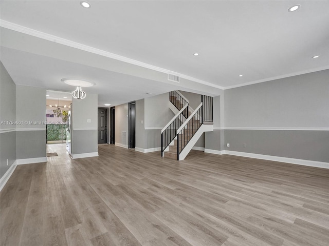 interior space with baseboards, stairs, recessed lighting, light wood-style flooring, and a notable chandelier