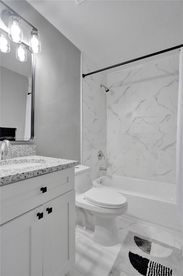 full bathroom with toilet, marble finish floor, shower / washtub combination, and vanity