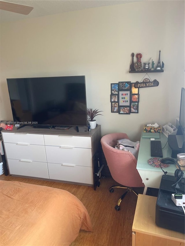 bedroom featuring wood finished floors