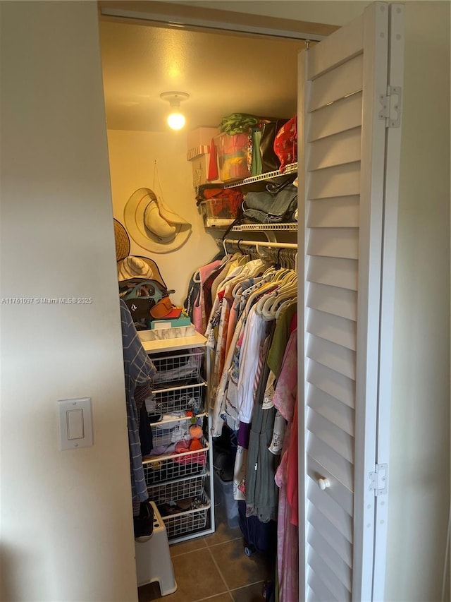 spacious closet featuring tile patterned floors