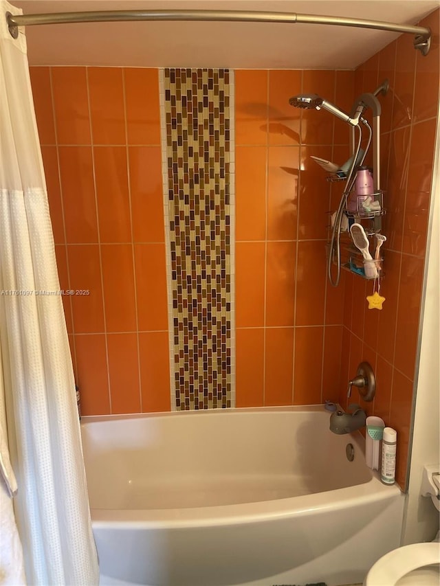 full bath with toilet and shower / tub combo