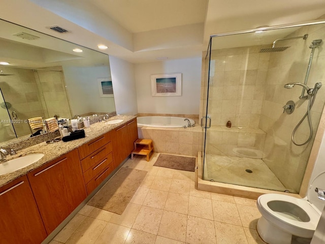 bathroom with double vanity, visible vents, a sink, and a stall shower