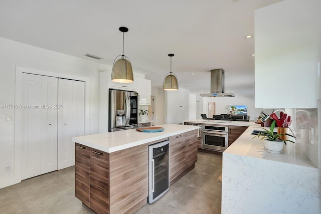 kitchen with beverage cooler, extractor fan, light countertops, appliances with stainless steel finishes, and modern cabinets