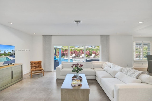 living room featuring visible vents, recessed lighting, and baseboards