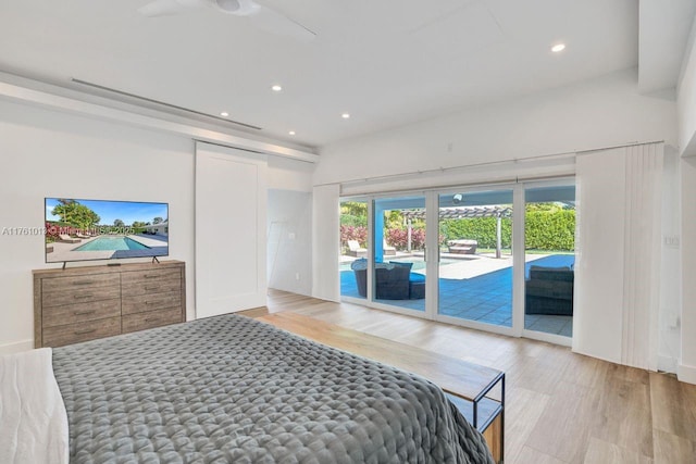 bedroom with recessed lighting, light wood-type flooring, and access to outside