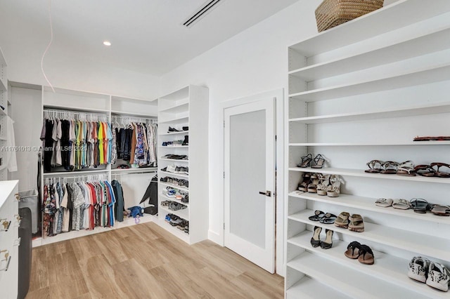 walk in closet featuring visible vents and light wood finished floors