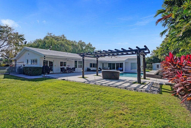 back of house with fence, a yard, an outdoor pool, a pergola, and a patio area