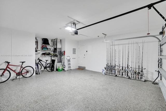 garage featuring electric panel and a garage door opener