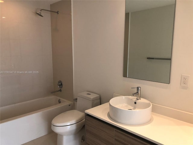 bathroom with vanity, toilet, and washtub / shower combination