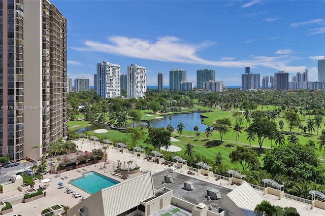 birds eye view of property with a view of city, golf course view, and a water view