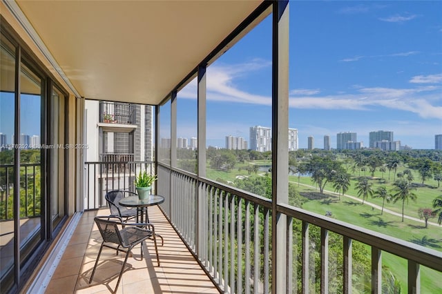 sunroom featuring a view of city