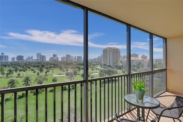 unfurnished sunroom featuring a view of city