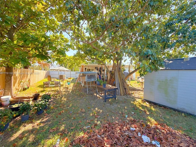 view of yard featuring a fenced backyard and an outdoor structure