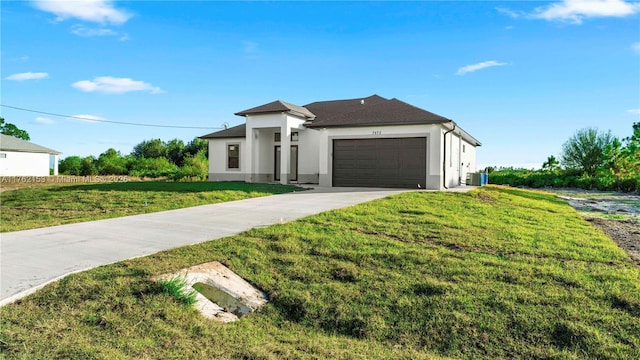 view of front of home with cooling unit, stucco siding, concrete driveway, a front lawn, and a garage