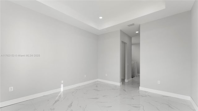 empty room with recessed lighting, visible vents, baseboards, and marble finish floor