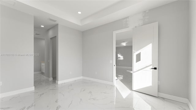 empty room with visible vents, recessed lighting, baseboards, and marble finish floor