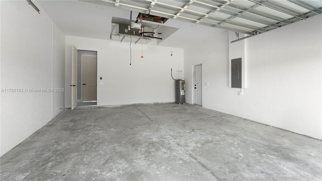 garage featuring electric panel and electric water heater