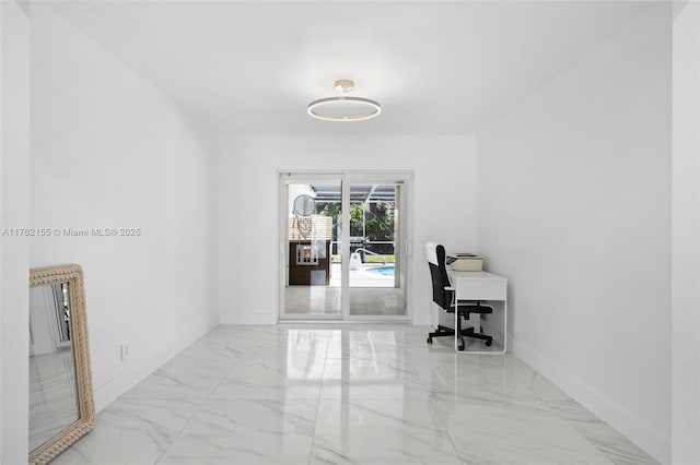 office with baseboards and marble finish floor