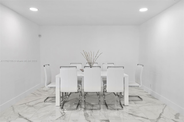 dining space featuring recessed lighting and baseboards