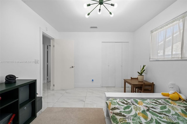 bedroom with visible vents, marble finish floor, a closet, an inviting chandelier, and baseboards