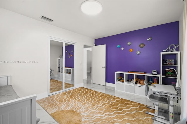 bedroom featuring visible vents, baseboards, and tile patterned flooring