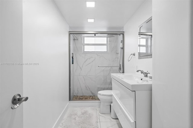 full bath featuring a marble finish shower, marble finish floor, and a healthy amount of sunlight