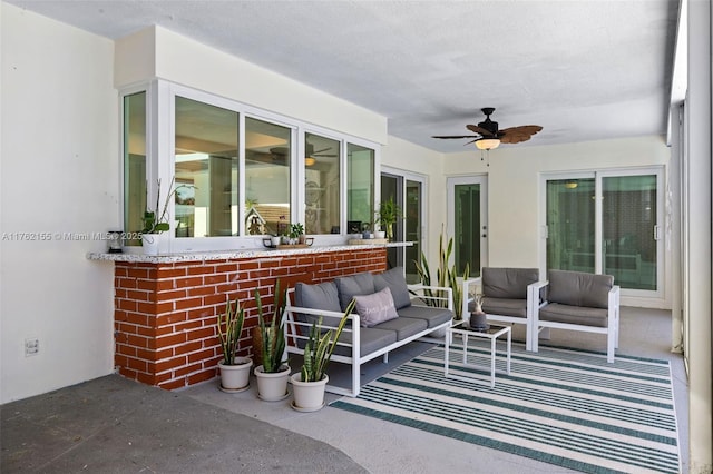 view of patio / terrace featuring an outdoor living space and a ceiling fan