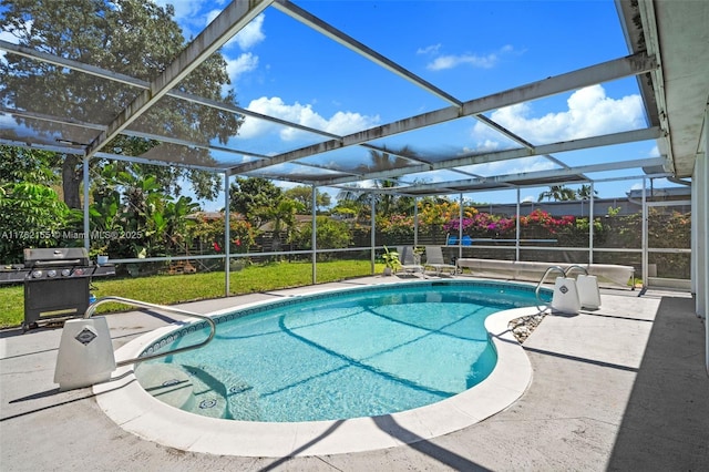 outdoor pool featuring a patio, a yard, and a lanai