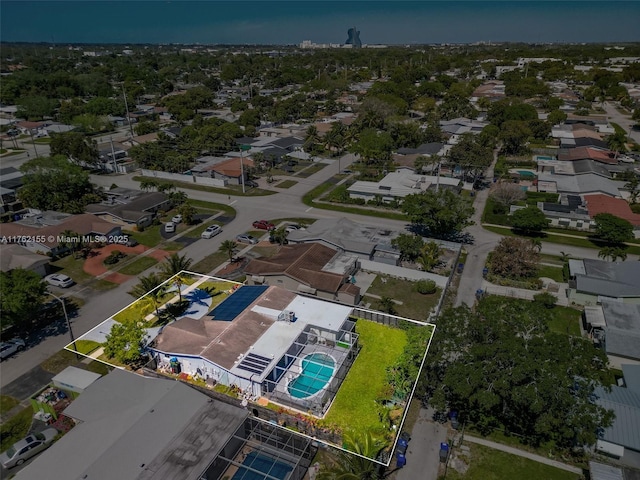 birds eye view of property with a residential view