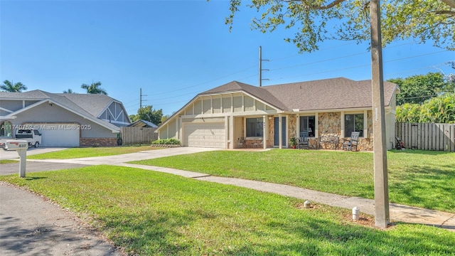 view of front facade with an attached garage, fence, board and batten siding, and driveway