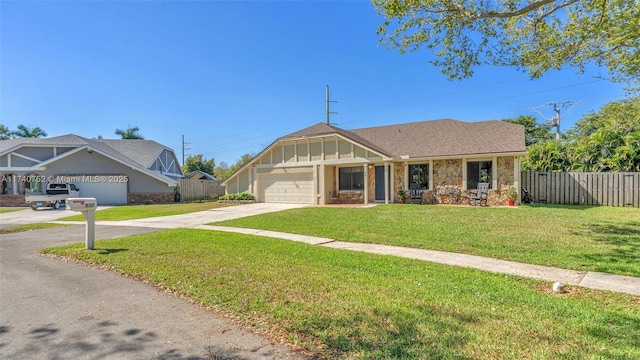 view of front of property featuring concrete driveway, a garage, fence, and board and batten siding