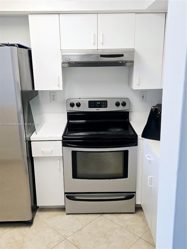 3300 NE 191st St Unit 609, Aventura, FL 33180 - kitchen with under cabinet range hood, white cabinets, stainless steel appliances, and light countertops