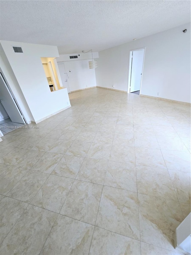 3300 NE 191st St Unit 609, Aventura, FL 33180 - living area with visible vents and a textured ceiling