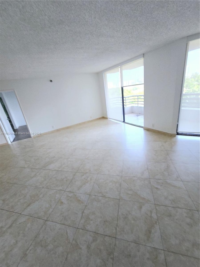 3300 NE 191st St Unit 609, Aventura, FL 33180 - spare room featuring a textured ceiling