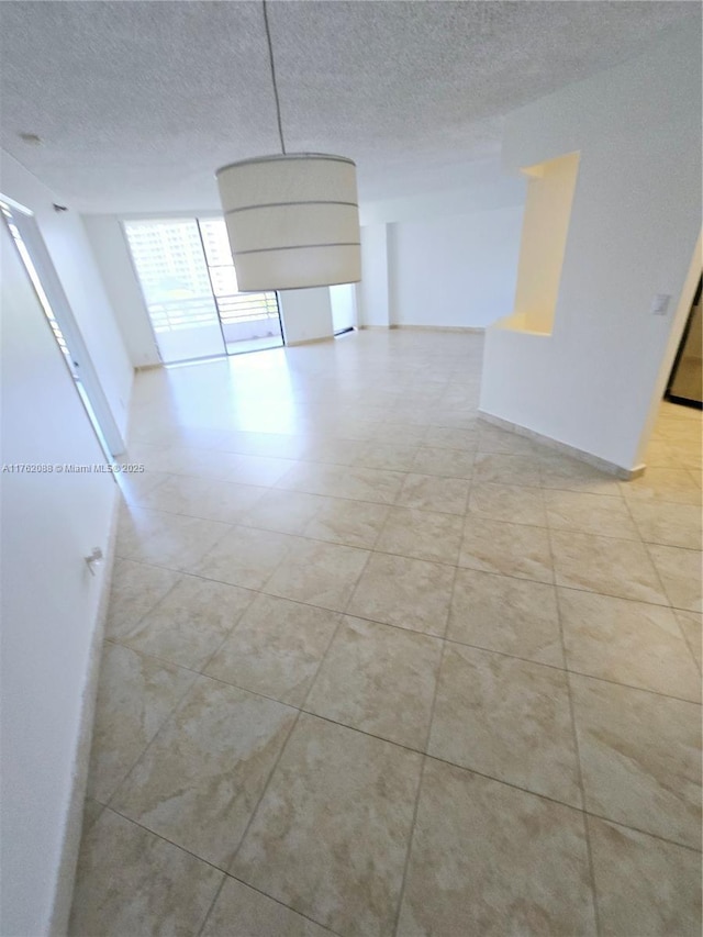 3300 NE 191st St Unit 609, Aventura, FL 33180 - empty room with a textured ceiling