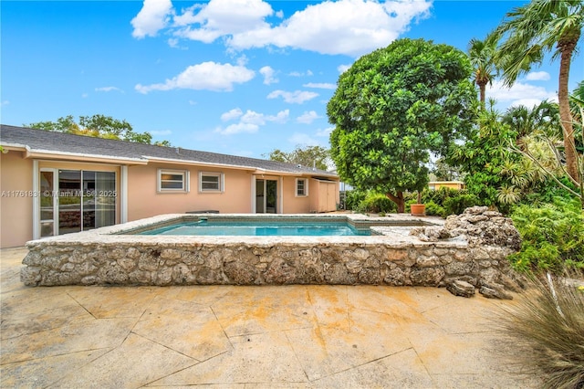 pool featuring a patio area