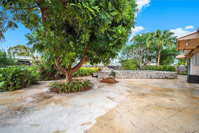 view of patio featuring fence