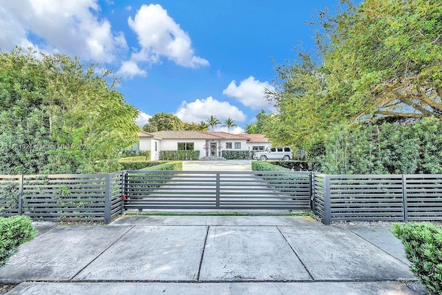 view of gate featuring a fenced front yard