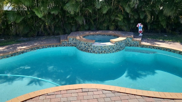 pool with an in ground hot tub