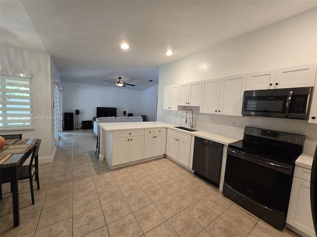14384 SW 167th Ter, Miami, FL 33177 - kitchen with black appliances, a peninsula, open floor plan, light countertops, and recessed lighting