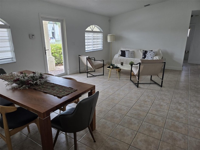 14384 SW 167th Ter, Miami, FL 33177 - dining room featuring light tile patterned floors and baseboards
