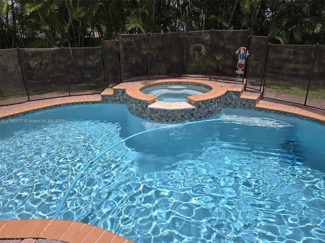 14384 SW 167th Ter, Miami, FL 33177 - view of swimming pool with a pool with connected hot tub