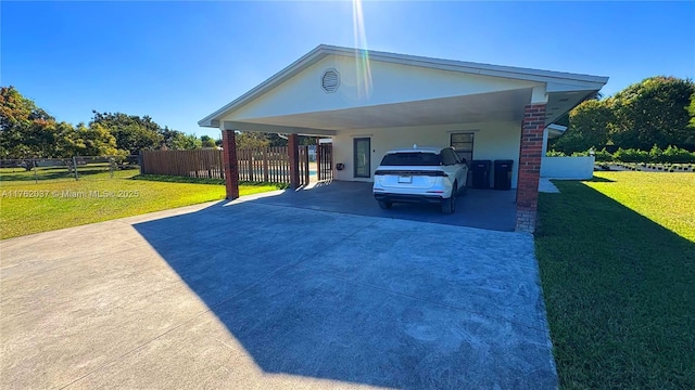 view of parking / parking lot featuring an attached carport, concrete driveway, and fence