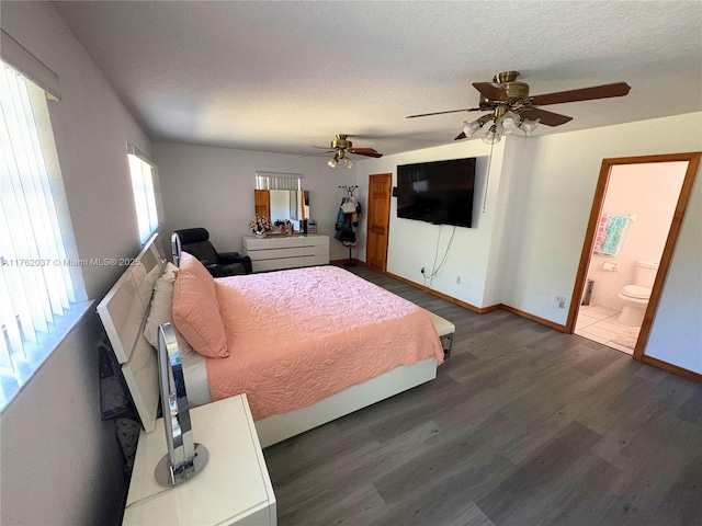 unfurnished bedroom featuring ceiling fan, a textured ceiling, baseboards, and wood finished floors