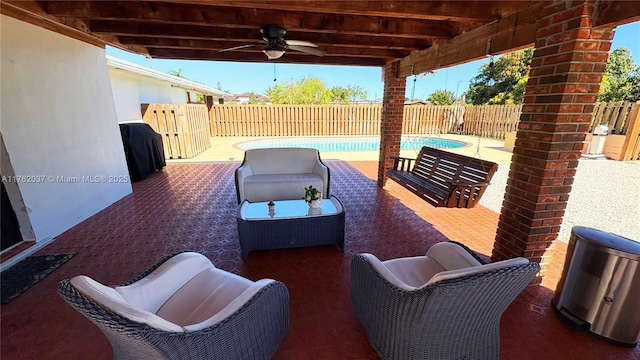 view of patio / terrace featuring grilling area, a fenced in pool, ceiling fan, an outdoor hangout area, and a fenced backyard